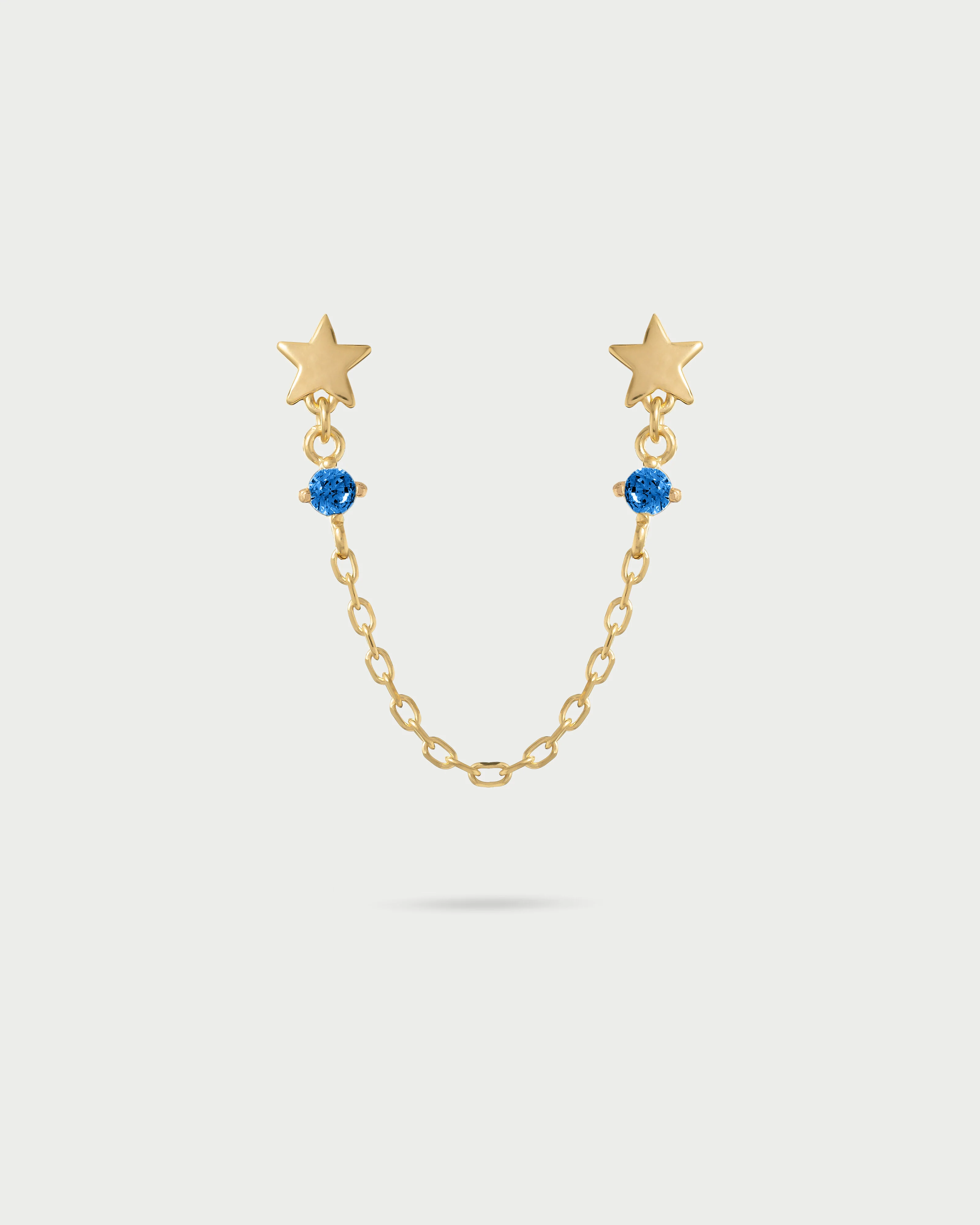 Orecchino double lobo catenella stelle con punto luce